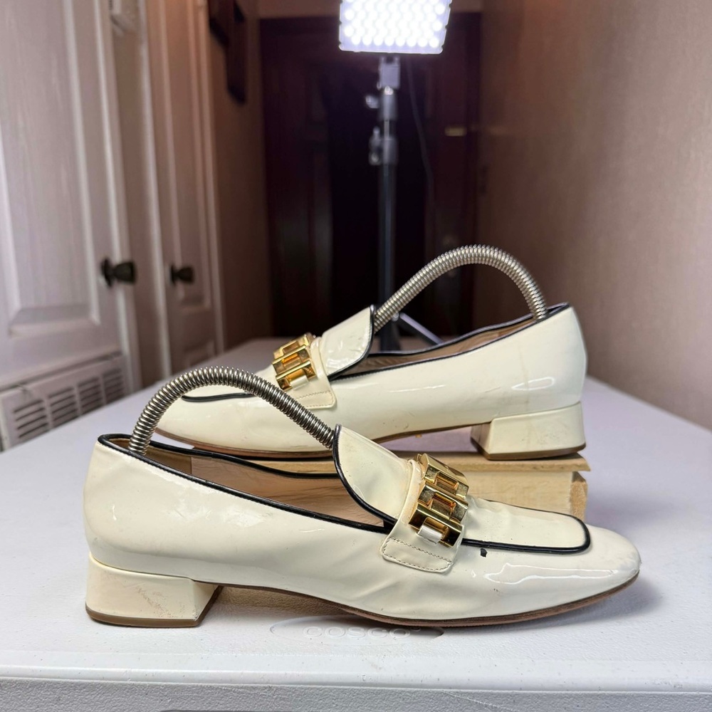Prada Cream Patent Leather Loafers with Gold Hardware